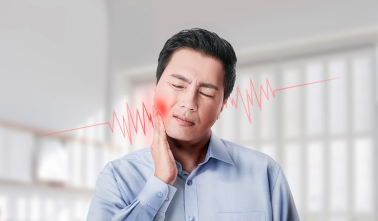 Could Ignoring Sensitive Teeth Lead to Implants? image 1